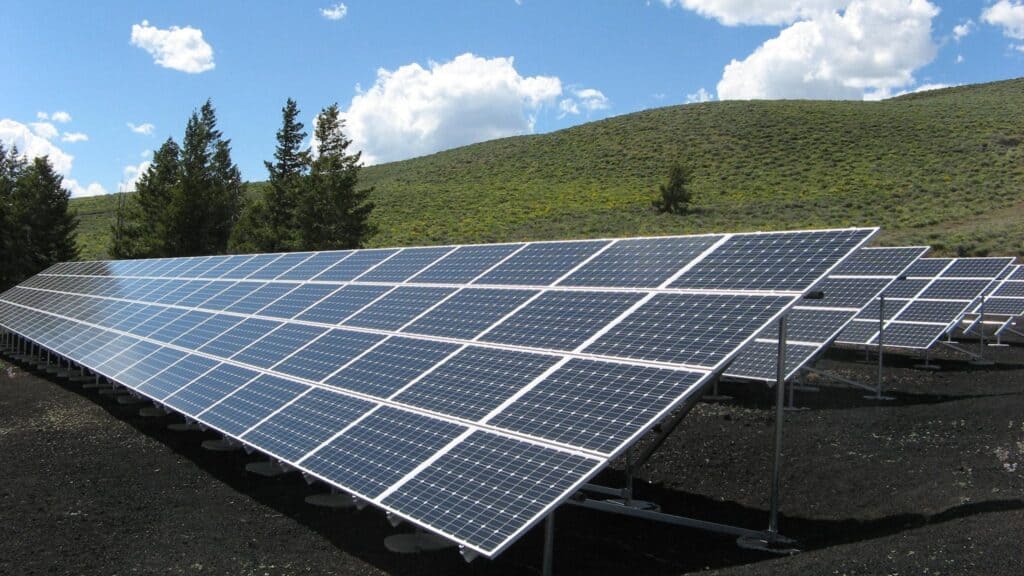 Black and Silver Solar Panels on homestead pasture
