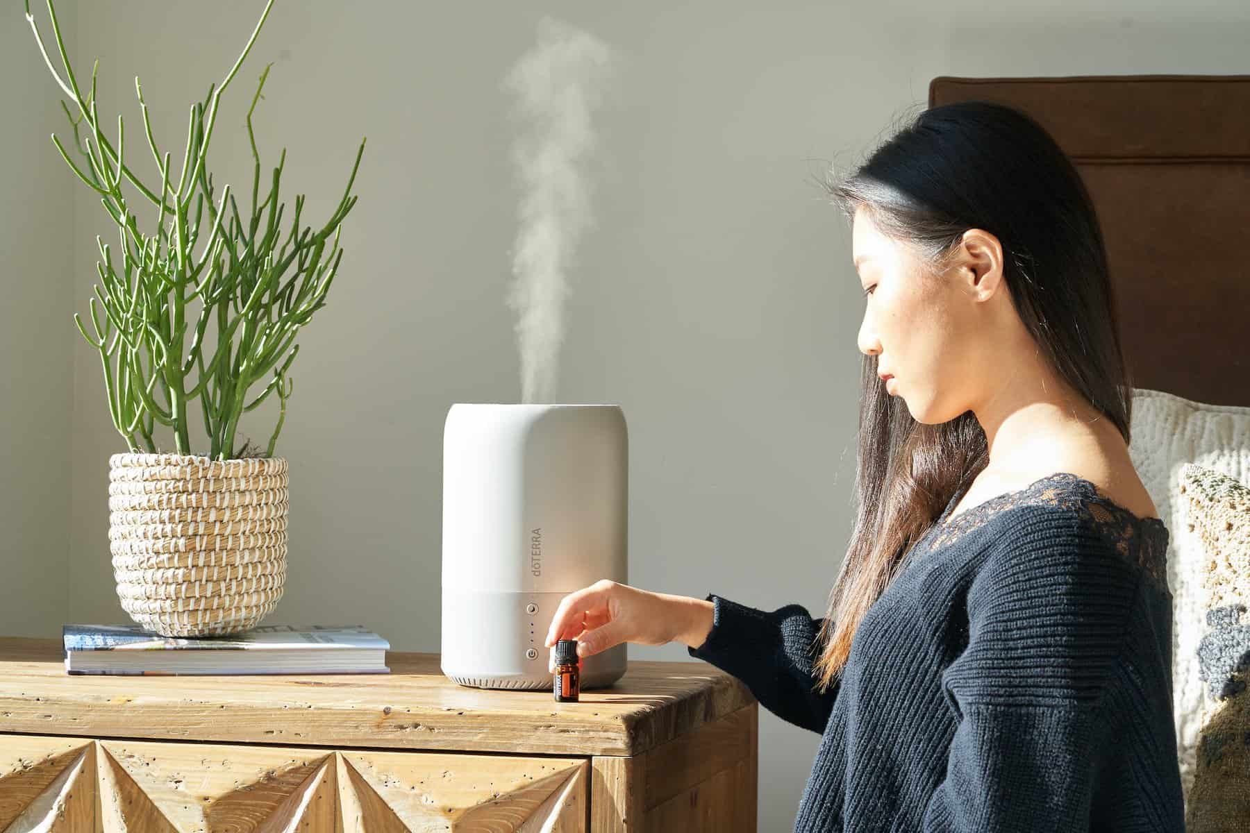 A Woman Holding a Brown Bottle with humidifier
